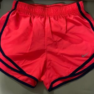 Nike women’s tempo shorts, size small, navy hand hot pink